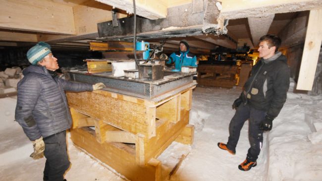 Expedition Leader Alain Hubert and a team of carpenters and engineers from IPF raise the annexes of the Princess Elisabeth Antarctica research station due to movement of the glacier its sits upon - © International Polar Foundation