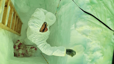 Sarah Wauthy from the ULB sampling snow in a trench she dug while doing work for the PASPARTOUT project - © International Polar Foundation, Sarah Wauthy ULB
