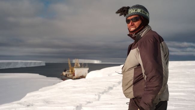 Alain Hubert on the Ice Shelf with the Ivan Papanin in the Background - © International Polar Foundation - 2009