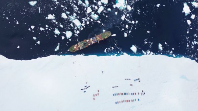 Cargo ship unloading on the coast of Antarctica - © International Polar Foundation