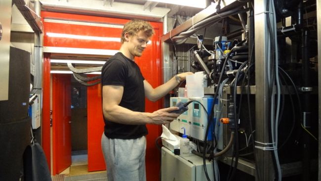 Jacob Bossaer at work on PEA's water treatment unit - © International Polar Foundation