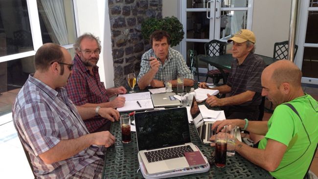 Alain Hubert, Craig Masson, Jacques Touchette, Kristof Soete and Christophe Berclaz discuss the work to be done at Princess Elisabeth Antarctica during the first weeks of the 2014-15 season. - © International Polar Foundation / Michel de Wouters