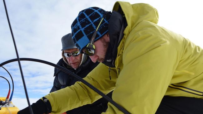 Frank Pattyn and Brice Van Liefferinge working on their radar machine - © International Polar Foundation / Jos van Hemelrijck