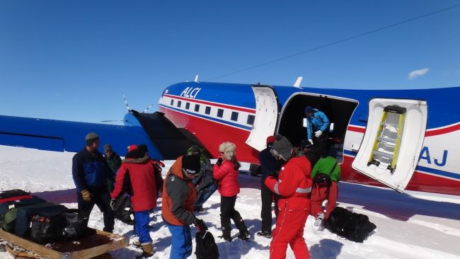 The team helps offloading the Basler DC-3 that just landed - © International Polar Foundation