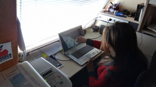 Nighat Amin showing where the ship is stuck in sea ice - © International Polar Foundation