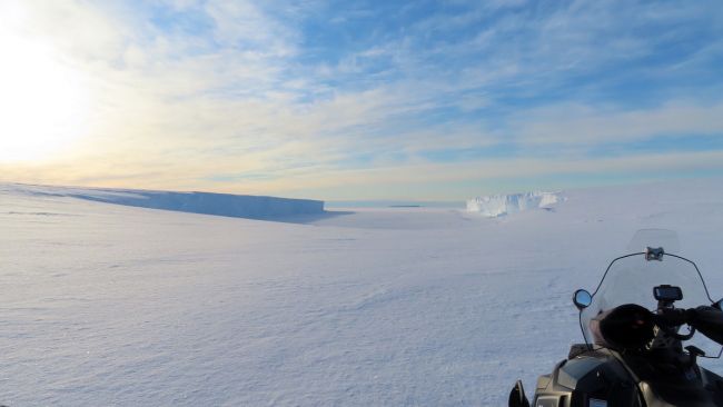 While searching for a suitable site to unload the supply ship, Alain Hubert and Daniel Mercier come across a stunning bay still covered by sea ice. - © International Polar Foundation 