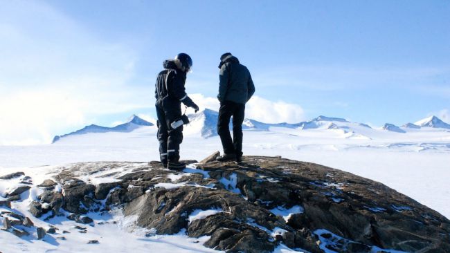 This year we had to install five seismometers that will take a minimum of one year of measurements. Our knowledge of the mountainous terrain helped Denis Lombardi find ideal locations to set up the seismometers, and also saved him a lot of time. Here we're standing on one of the last nunataks as you head from the coast towards the South Pole. - © International Polar Foundation