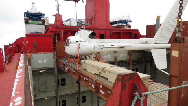 First helicopter being offloaded from the Mary Arctica. - © Michael Worm (Chief Engineer, M/V Mary Arctica)