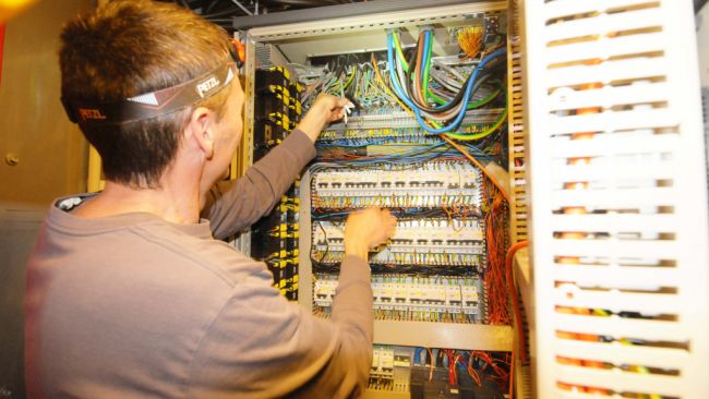 Solar panel expert Johan Demuylder is working on an electric panel at the Princess Elisabeth Antarctica to improve the solar power performance of the station. - © International Polar Foundation