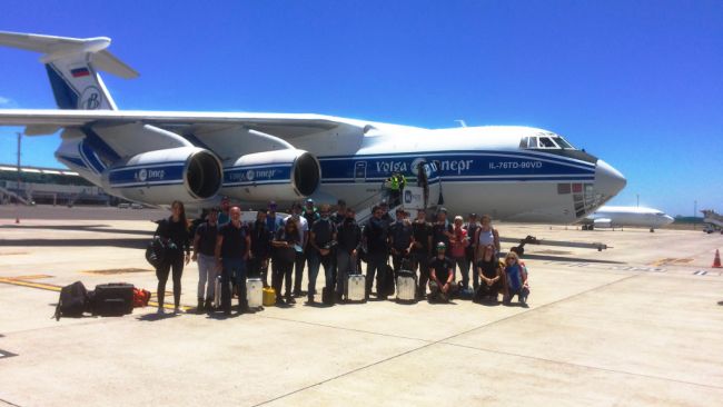 The first team of scientists along with a team from Monegasque electric vehicle manufacturer Venturi board the plane for Antarctica at Cape Town International Airport. - © International Polar Foundation