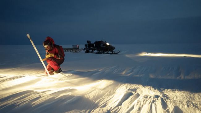 Alain Hubert taking up GPS positions on the Antarctic Plateau for the Glacioclim project - © International Polar Foundation - René Robert