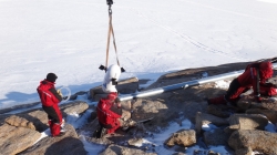 Craig, Illir and François installing the new wind turbine - International Polar Foundation / Alain Hubert