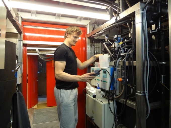 Jacob Bossaer at work on PEA's water treatment unit - International Polar Foundation