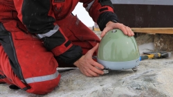 Denis Lombardi installing the seismometer - International Polar Foundation