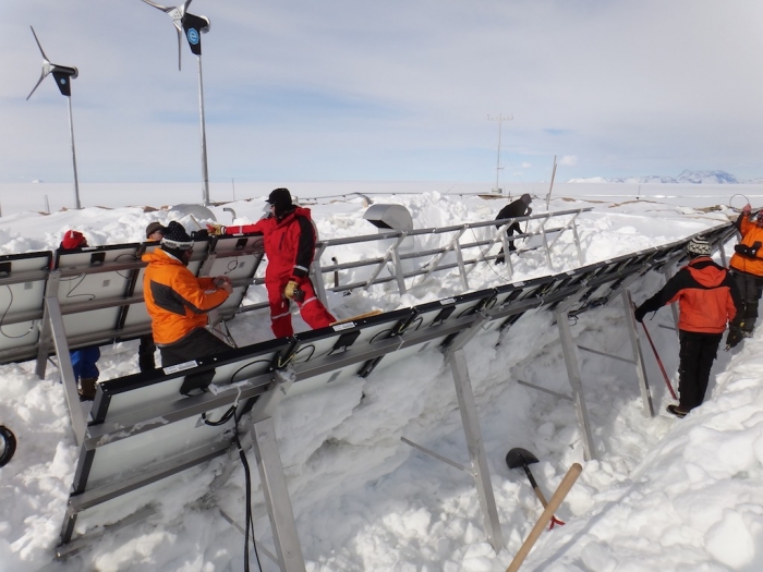 Starting to remove solar panels to replace them with more efficient ones. - International Polar Foundation