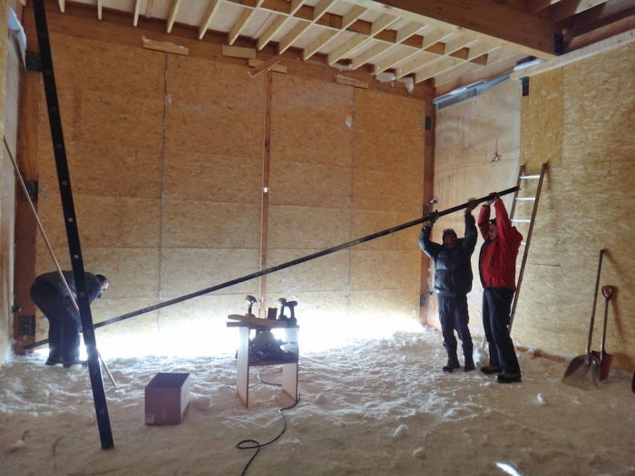 Working on the garage doors. - International Polar Foundation