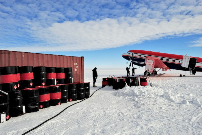 Basler plane refueling using the drums bought by the Mary Arctica. - International Polar Foundation