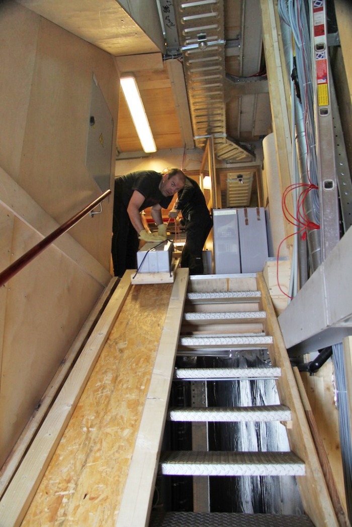 To move batteries up and down the stairs more easily, we build a little ramp. - International Polar Foundation
