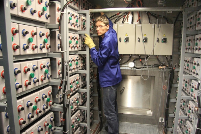 Regis installing the new batteries. - International Polar Foundation