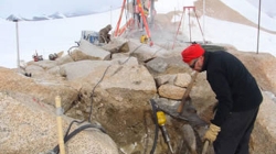 Preparing anchoring points in the loose substrate and permafrost. - International Polar Foundation / René Robert