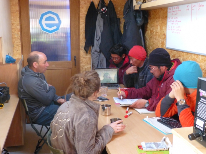 Field guide Christophe and the Belgo-Japanese SAMBA meteorite team holding a briefing at the field camp, before heading out to search for meteorites on the plateau. - International Polar Foundation/Alain Hubert