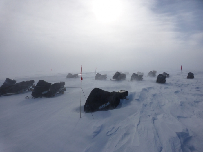 Skidoos at the field camp covered up against the intense blizzards of Antarctica. - International Polar Foundation/Alain Hubert