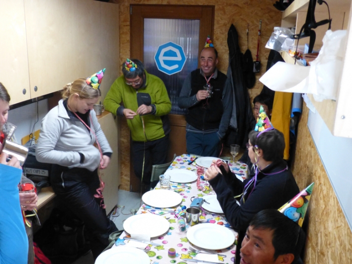 Happy New Year! SAMBA and Princess Elisabeth Antarctica team celebrating 2013 in the cosy confines of the field camp container. - International Polar Foundation/Alain Hubert