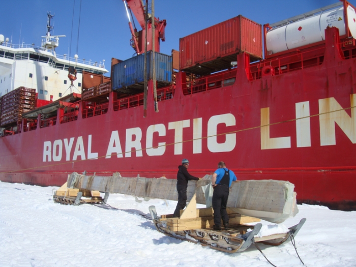 Unloading beams from the Mary Arctica at the Antarctic Coast, before transportation to Princess Elisabeth Antarctica, for use in constructing a new entrance hall.  - International Polar Foundation/Alain Hubert