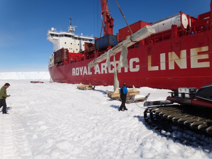 Unloading beams from the Mary Arctica at the Antarctic Coast, before transportation to Princess Elisabeth Antarctica, for use in constructing a new entrance hall.  - International Polar Foundation/Alain Hubert
