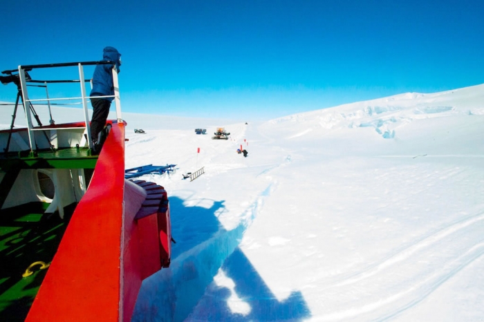 The S.A. Agulhas was anchored in a crevasse, which helps it remaining stable during the unloading. - International Polar Foundation