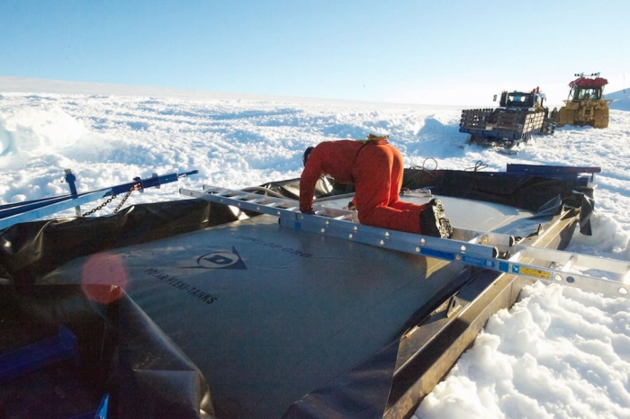 Duncan is controlling the fully loaded fuel bladders. - International Polar Foundation