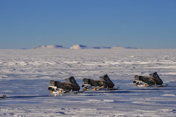Belgo-Japanese SAMBA meteorite team skidoos parked at the basecamp on the plateau, during a field trip on the Nansen Ice Field, 140km south of Princess Elisabeth Antarctica, during the BELARE 2012-2013 expedition.  - International Polar Foundation