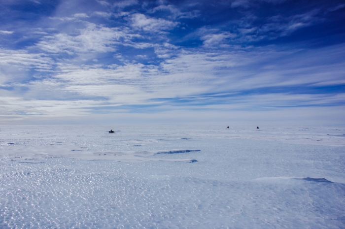 Members of the Belgo-Japanese SAMBA team, mounted on skidoos, fan out in v-shaped formation across the Nansen Ice Field, in order to search for meteorites during a field trip on the plateau, 140km south of Princess Elisabeth Antarctica. - International Polar Foundation