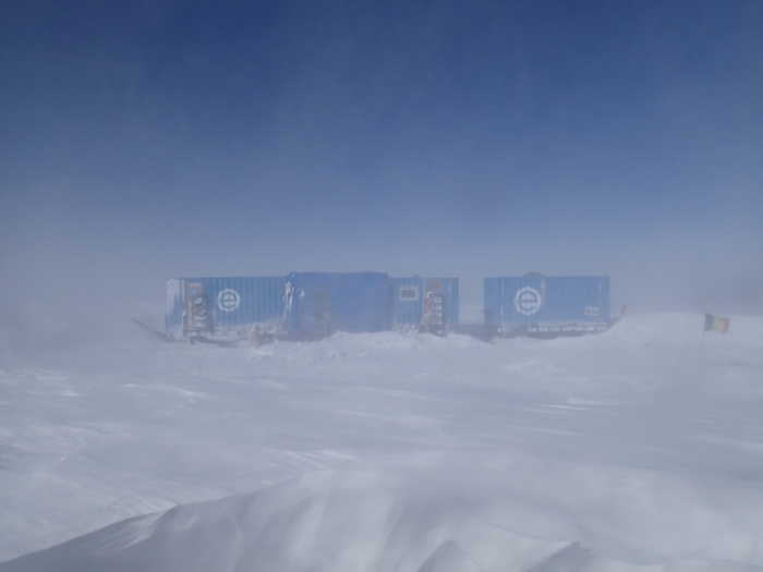 Belgo-Japanese SAMBA meteorite team basecamp on the plateau composed of three containers: A technical container, A living container and a dormitory are unified on sledges to be easily movable. during the BELARE 2012-2013 expedition.  Field trip on the Nansen Ice Field, 140km south of Princess Elisabeth Antarctica, during the BELARE 2012-2013 expedition.  - International Polar Foundation