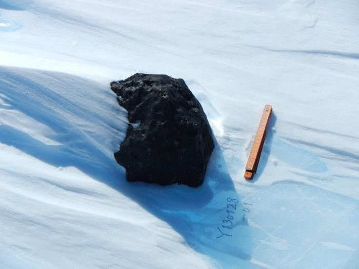 An 18kg meteorite found by the Belgo-Japanese SAMBA meteorite team during a field trip on the Nansen Ice Field, 140km south of Princess Elisabeth Antarctica, during the BELARE 2012-2013 expedition.  - International Polar Foundation/Vinciane Debaille
