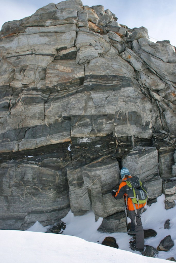 Observing the rocks before taking samples. - International Polar Foundation