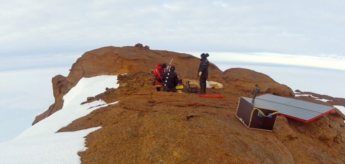 Installing the repeater antenna prepared by our in-house radio specialist, Karel Moerman. - International Polar Foundation