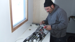 Kristof Soete prepares the CTD to be used at the coast in a few days. - International Polar Foundation / Alain Hubert
