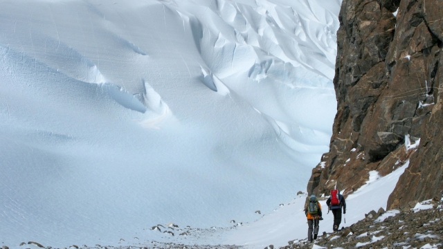 In the middle of a Windscoop during a survey. Windscoops are saucer-like depressions in a snow slope or surface caused by wind erosion. - International Polar Foundation