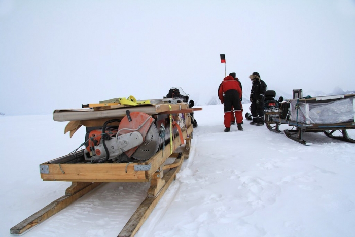 Bringing the gear into the field: the seismometer, the batteries and the solar panels - International Polar Foundation