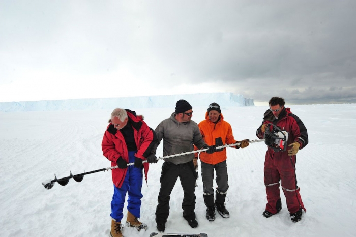 Evaluating the thickness and solidity of the ice before driving on it with the tractors. - International Polar Foundation
