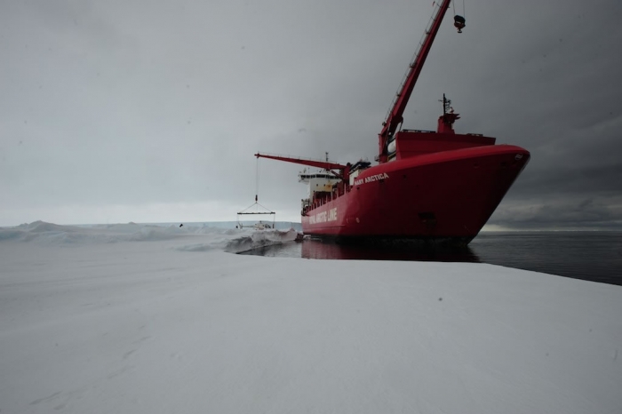 Unloading the first helicopter. As you can see, we're standing on roughly 2 meters of sea ice. - International Polar Foundation